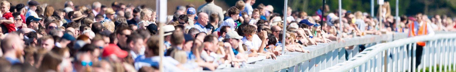 Crowds enjoying a day at the races