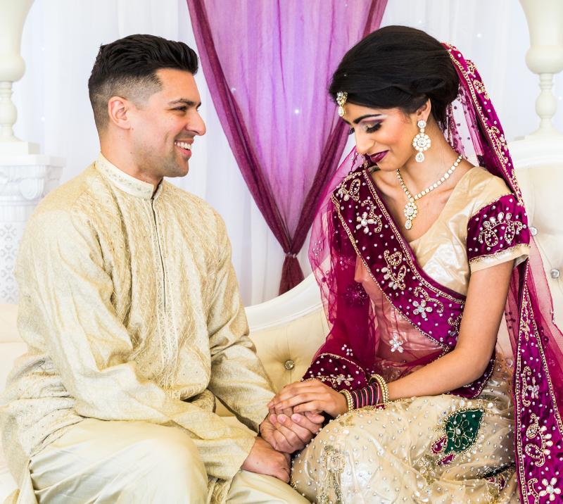 An Asian couple enjoy their wedding at Bath Racecourse
