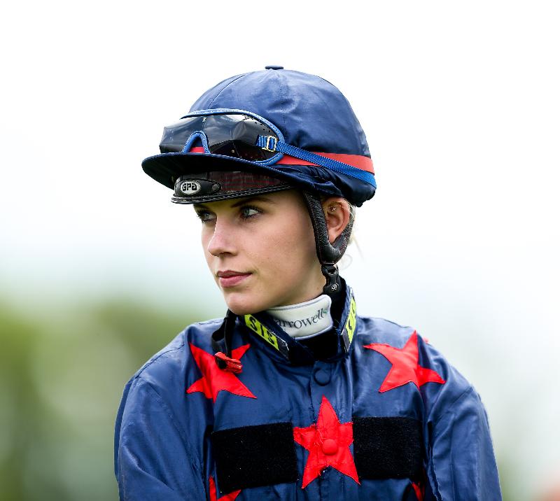 A profile picture of a jockey in full silks.